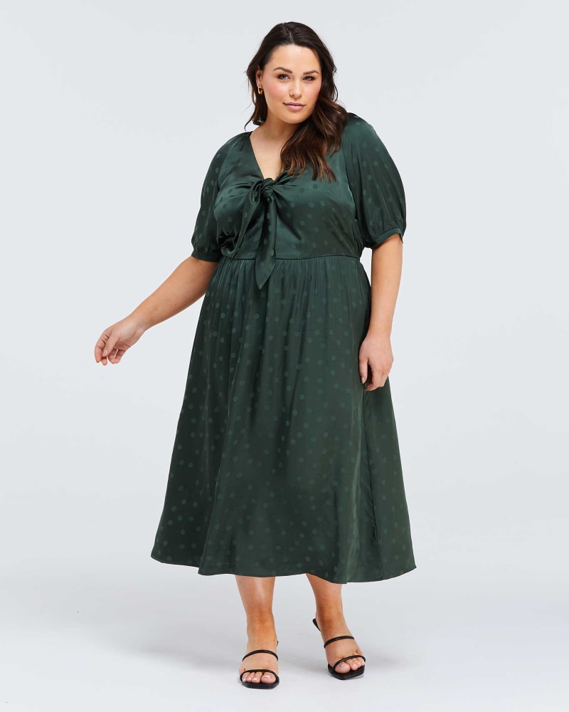 Front of a model wearing a size 4X Rossa Jacquard Spot Dress in Sage by Estelle. | dia_product_style_image_id:264501